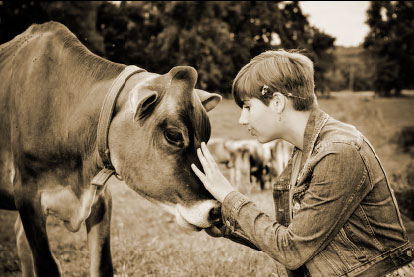 Bailey with a Jersey cow